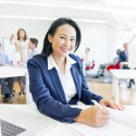 Young female professional in office setting