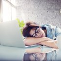 Young female asleep at desk